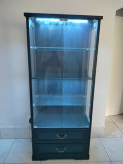 Tall glass enclosed shelving