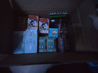 Box of assorted toys and wallets