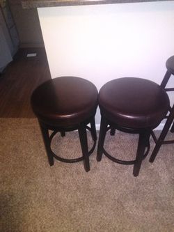 Smaller 2 bar stools good condition rotates, and are sturdy, 2 taller bar stools don't rotate but are sturdy. In