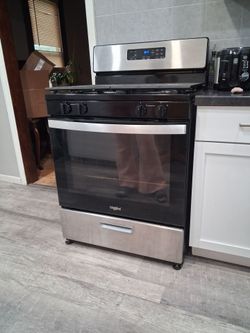 Black whirlpool gas range and stove