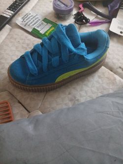 Blue and lime green pumas size women 7 1/2