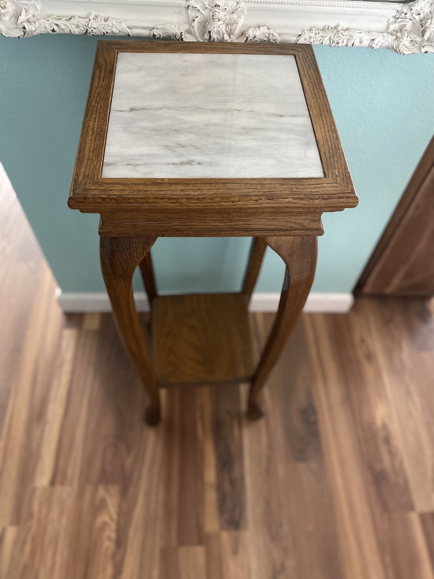 Oak pedestal table with marble top