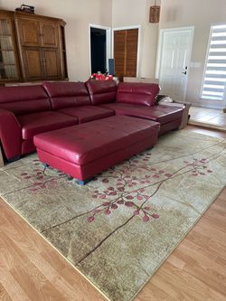 Sectional couch with chaise and rug