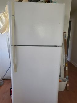 Kenmore refrigerator and Hotpoint gas stove.  Good condition.