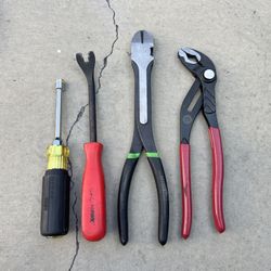 Panel clip remover, a pair of long reach diagonal cutters, and a pair of tongue-and-groove pliers.  