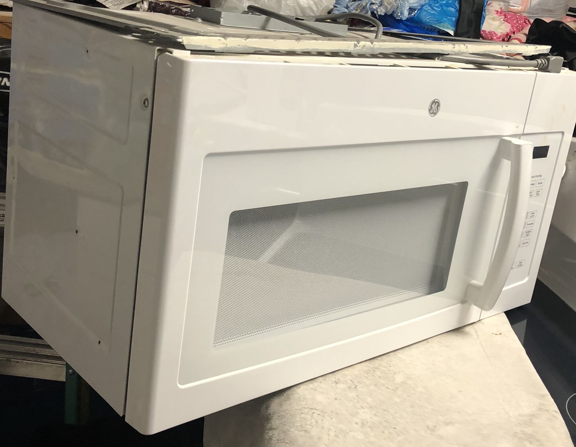 General Electric over the range white microwave