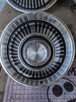 1964/54 OEM 14 inch Pontiac hubcaps