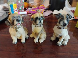 3 dog figurines