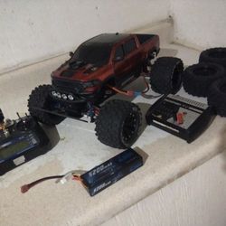 traxxas stampede 4x4 brushed, 2 batteries , charger, and 2 set of weels