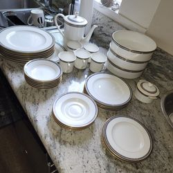 Mikasa China dinner set with base with black and gold rim