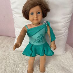 American Girl Doll Wearing Ice-Skating Dress And Tights And Star Shaped Earrings
