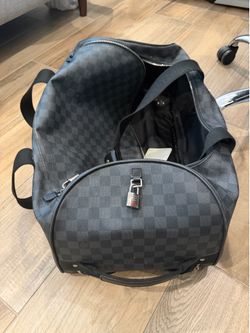 Louis Vuitton Damier Graphite rolling duffel/travel bag.