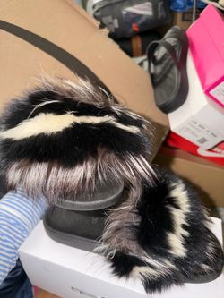 Fur slides size runs small but fits a size 11 women