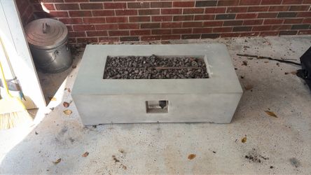 Modern fire pit with lava rocks and concealed propane tank