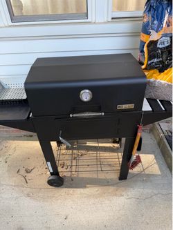 Charcoal grilling kit with griddle, grill basket, and smoker tube