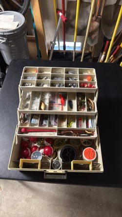 5 Fishing Poles and 1 Tackle Box