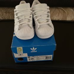 White Adidas “shell toe “ OrthoLite