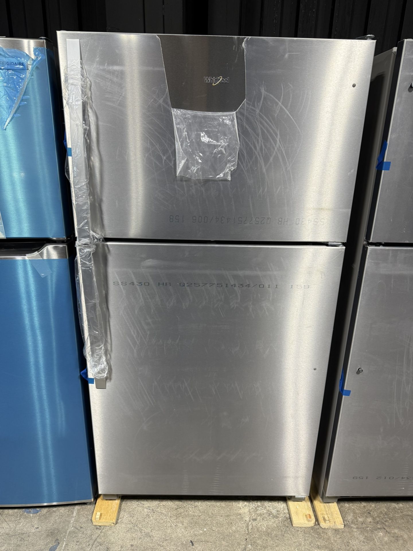 Brand new Whirlpool 33 in. 20.5 cu. ft. Wide Top Freezer Refrigerator in Monochromatic Stainless Steel with Frameless Glass Shelves