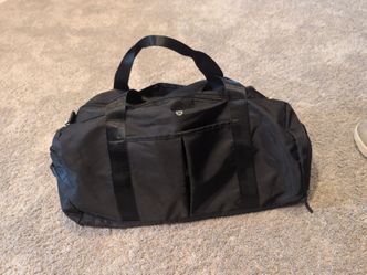 Brand new Lululemon black overnight duffel bag