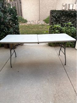 Folding utility table