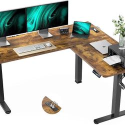 DK38 $120  63×55 in Electric Corner L-Shaped Standing Desk with 4-in 1 Electical Outlet, Computer Desk with Headphone Hook, Memory Sit Stand up Home O
