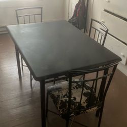 Table And Three Chairs