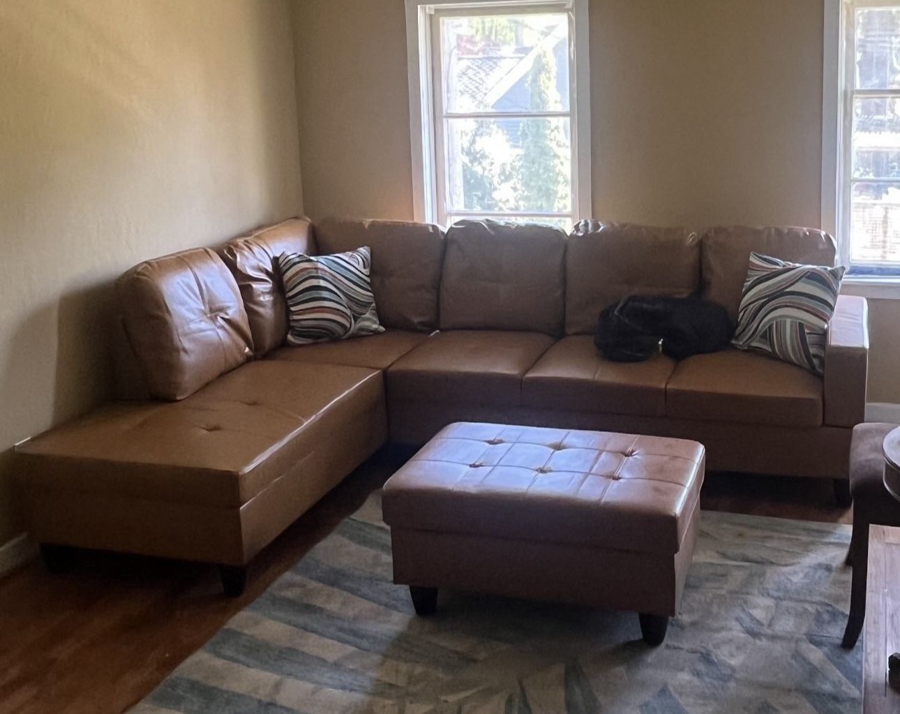 Carmel Brown Leather Sectional Couch And Ottoman