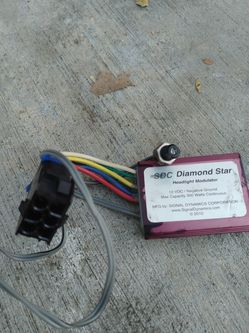 Motocycle headlight strobe module