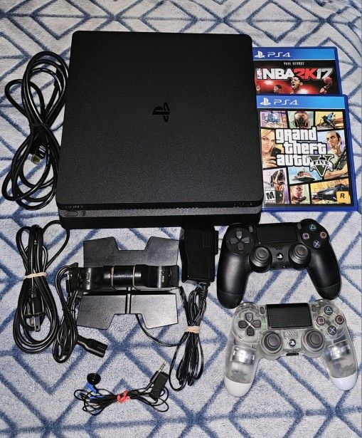 PS4 Slim 2 Duel Shock Controllers/charger. Plus 2 Games.