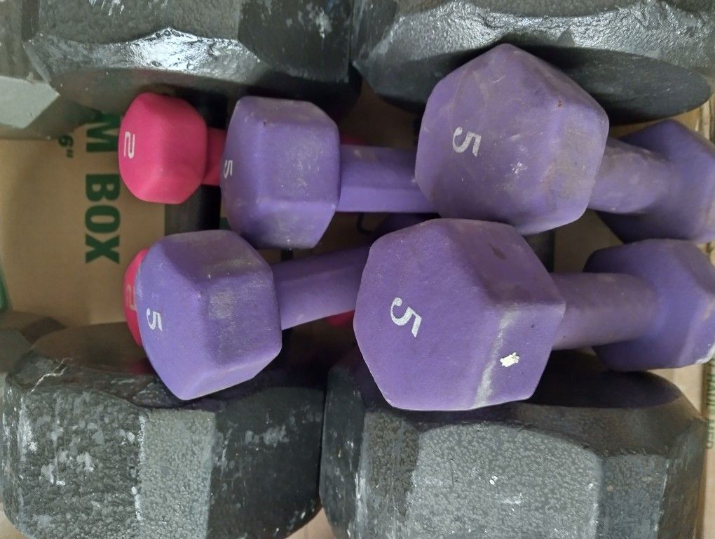 FOUR FIVE POUND AND TWO TWO POUND DUMBBELLS.