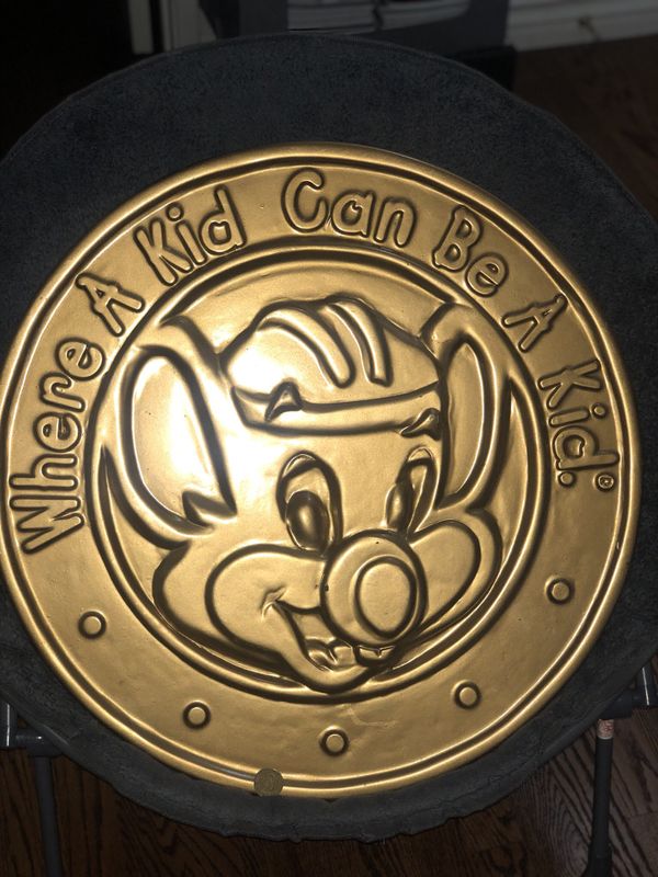 Pair of giant wooden Chuck E. Cheese wall display tokens Pair of giant wooden Chuck E. Cheese wall display tokens