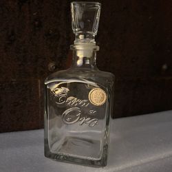 Empty Cava de Oro Bottle.