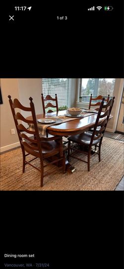 Extendable oak dining table with chairs and protective pad