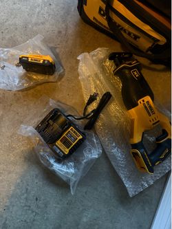 dewalt xr reciprocating saw with charger and battery.