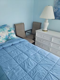 White chest of drawers and chair