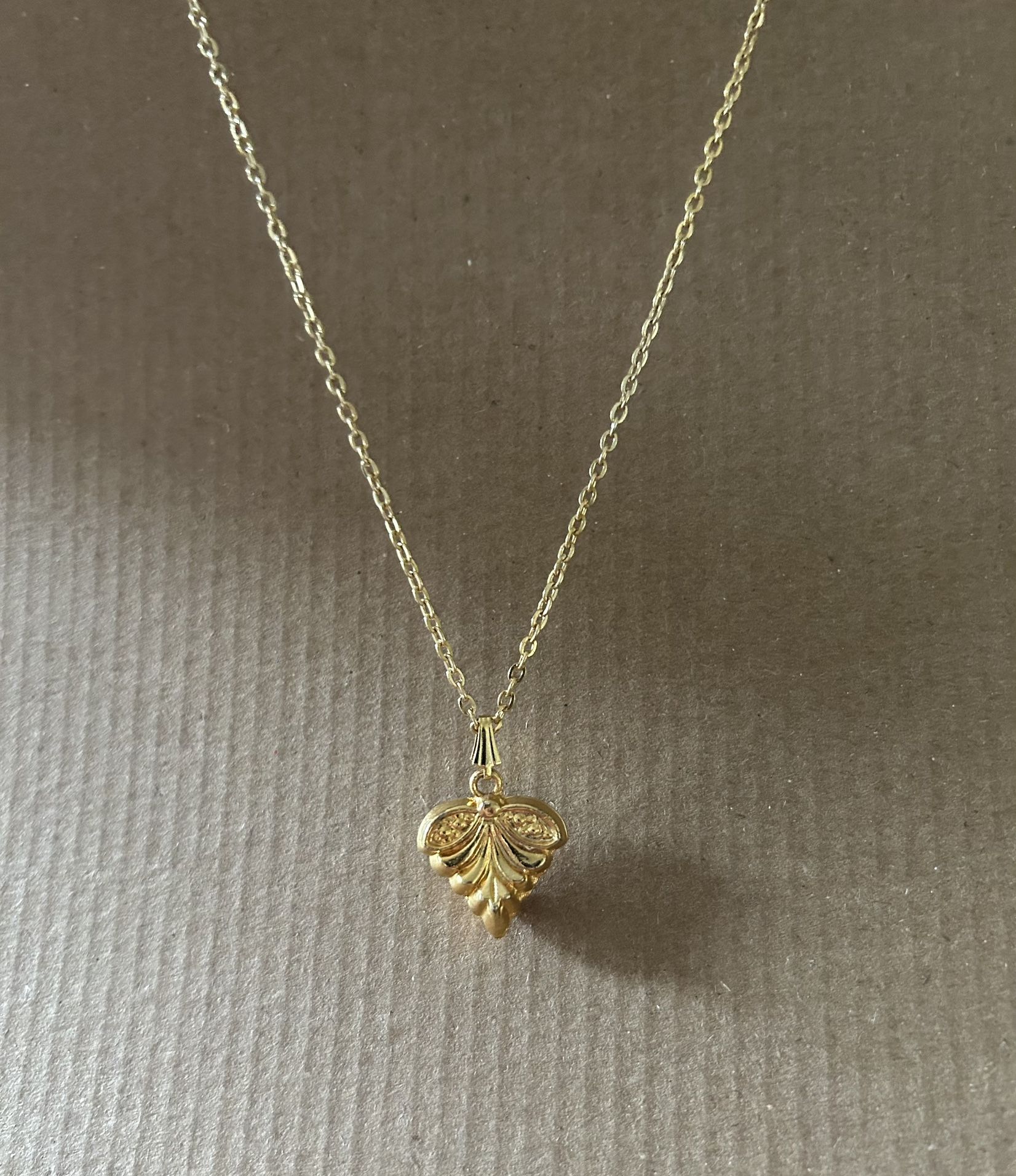 Gold color long necklace with pendant