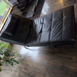Black faux convertible chaise lounge sleeper, "click-clack" lounge