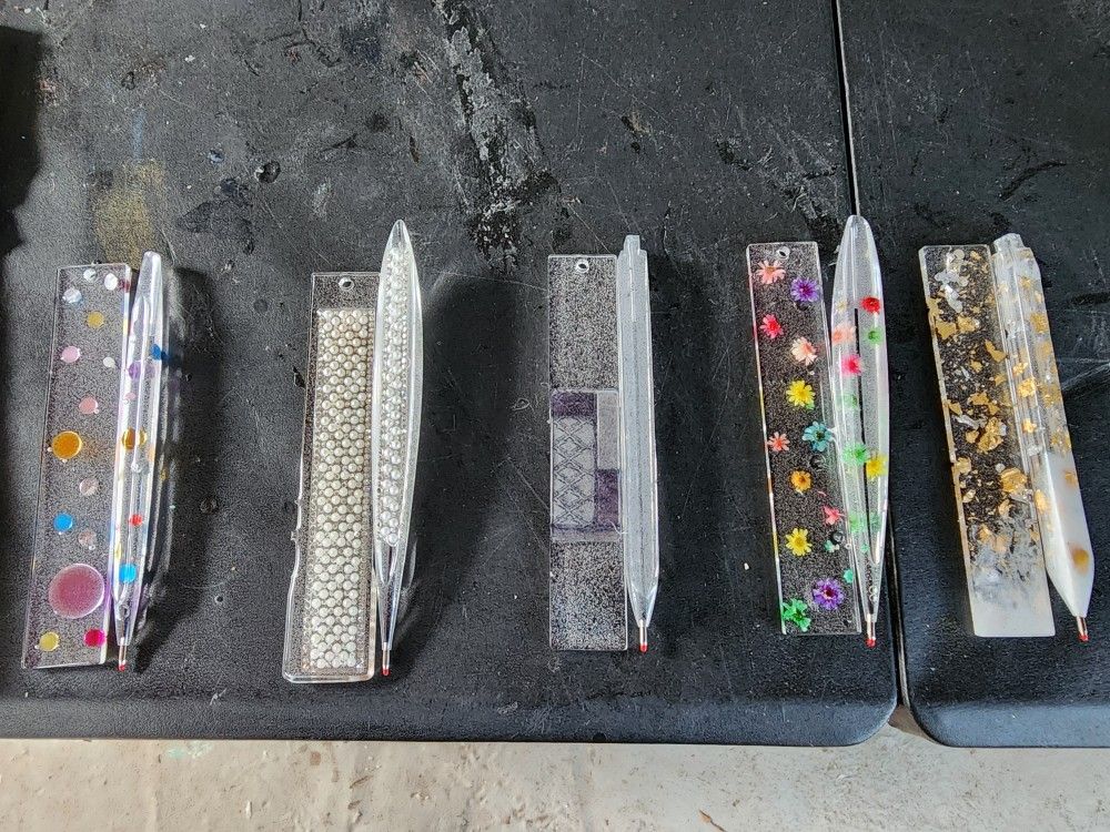 2pc. None REFILL Resin Pens & Matching Bookmark.