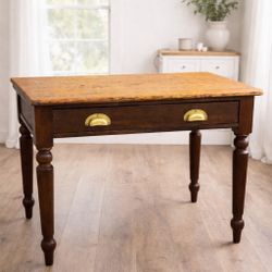 Wooden table with drawer, brass pulls. Could be desk or console table.
