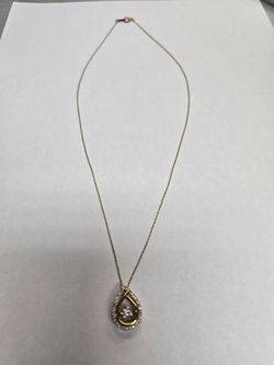 10k Gold necklace Drop pendant with diamonds.
