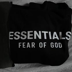 all black essentials hoodie with white letters 