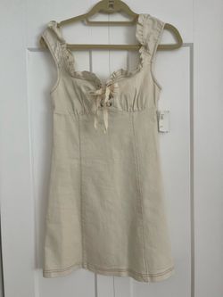 Urban Outfitters off-white denim mini dress with lace-up front and ruffled trim size S - NWT