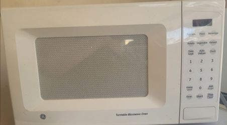 General Electric Mini microwave Measures 11 inches high and 18 inches wide.