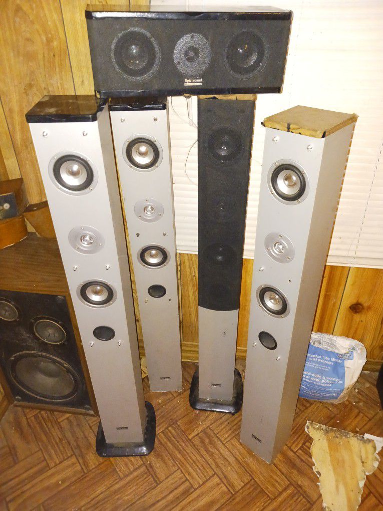 4 Tower Speakers And 1 Small Center Speaker