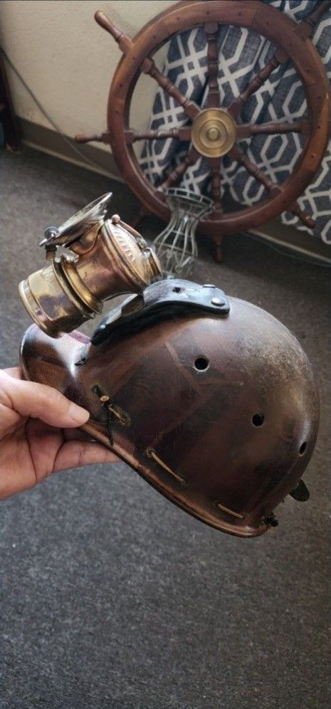 miner's helmet with antique lamp in good condition