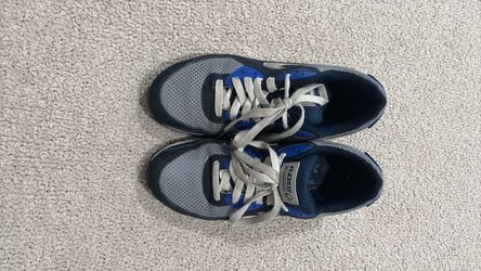 Nike Air Max 90 in navy blue, gray, and blue.