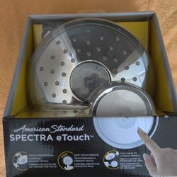 Brand new American Standard SPECTRA eTouch chrome shower head. 