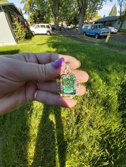 Super pretty silver necklace folied glass. I can give u a chain too.