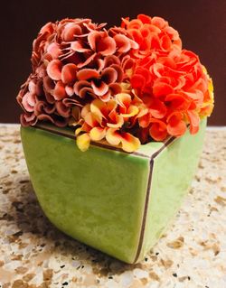 Cute small decorative flowers with vase