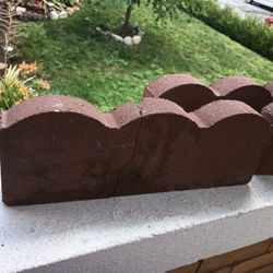Three Garden Surround Decorative Bricks. Rustic Color Brown. 15 And Three Fourth Inches Wide By 5 And One Half Inches Tall.